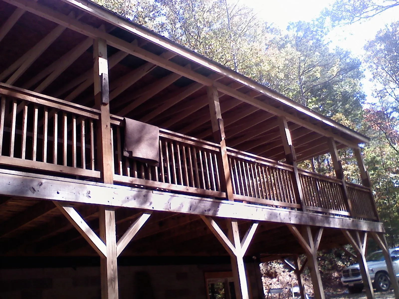 Timber framing under a new elevated porch and deck — Roof Leak Repair in Clackamas by Roofing Brothers